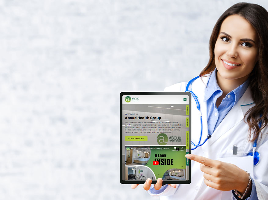 Female doctor showing Aboud Health Group website in tablet version
